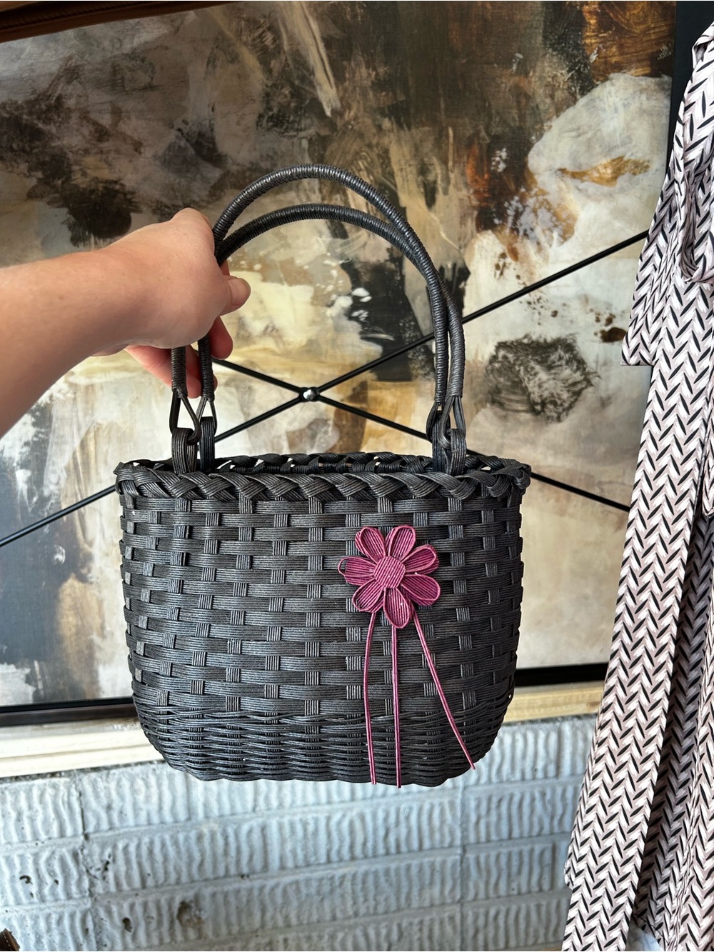 Woven Black Handbag with Pink Flower Accent